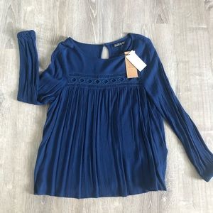 Blue long sleeve top.